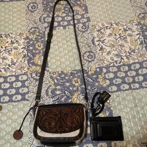 Cowhide on one side is a little roughed up.